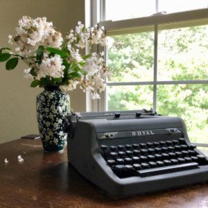 The Feisty Freelancer - image of typewriter and flowers